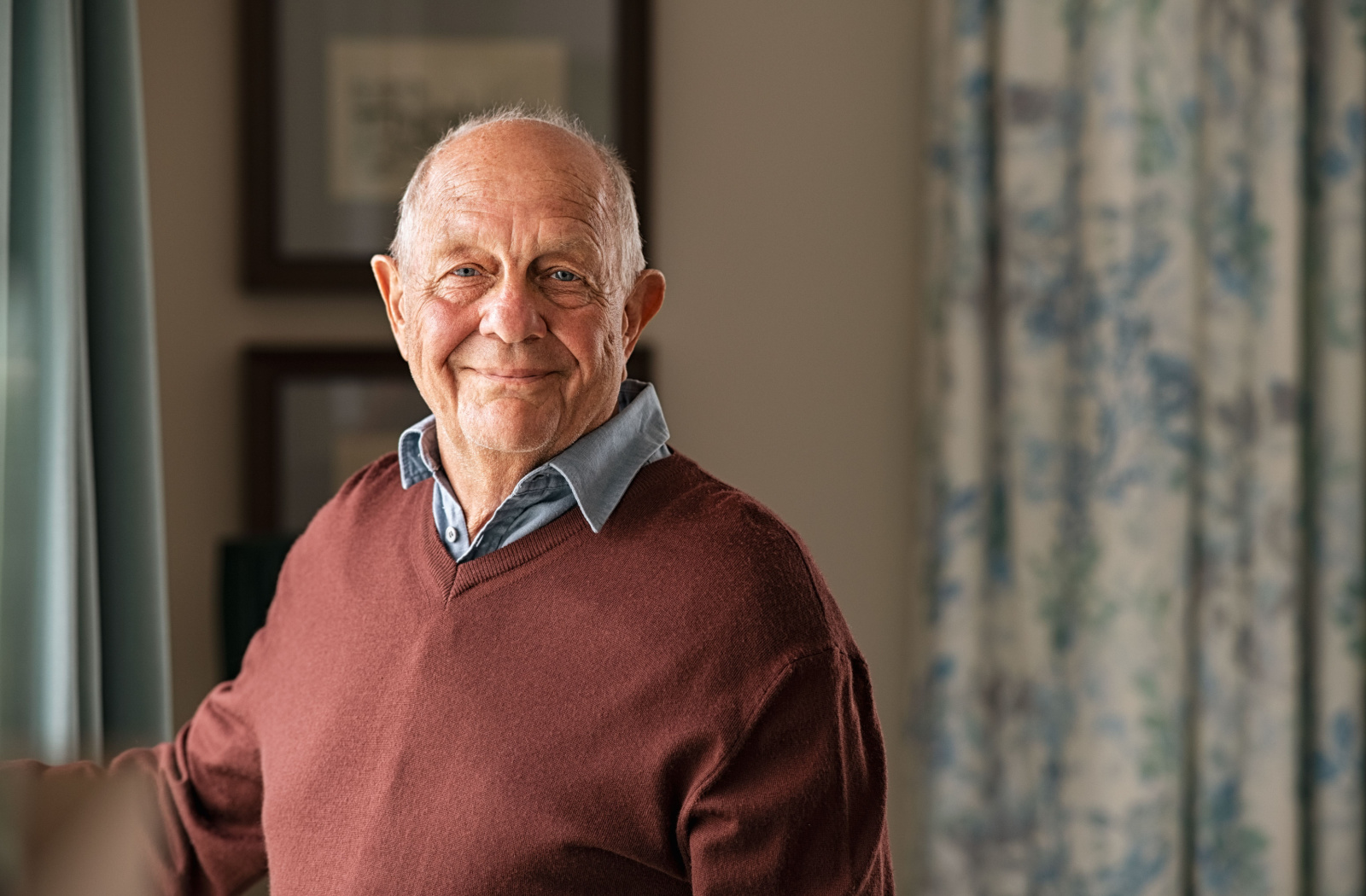 Senior man smiling.